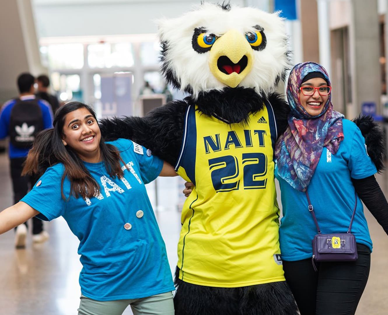 NAIT international centre students pose with the Ook mascot NAIT International centre and the Ook