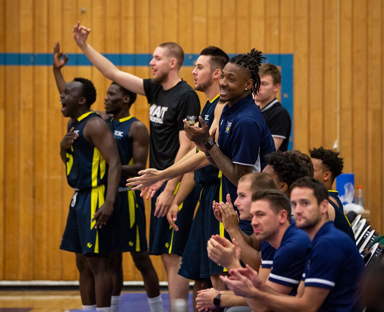 Basketball teammates cheer on their team
