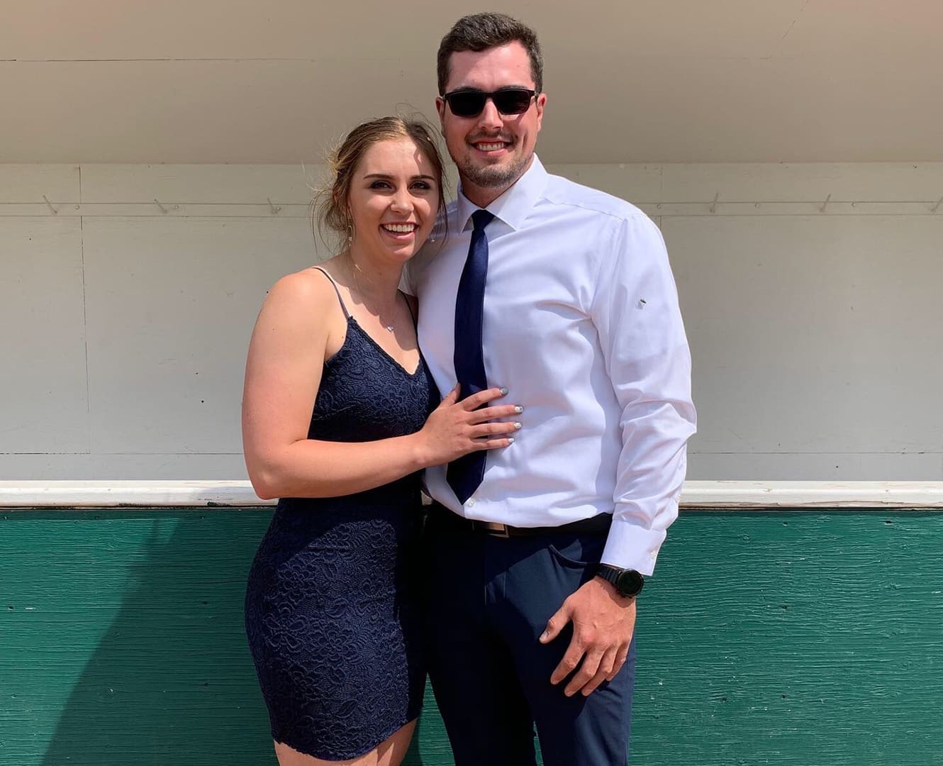 Man and woman pose dressed up