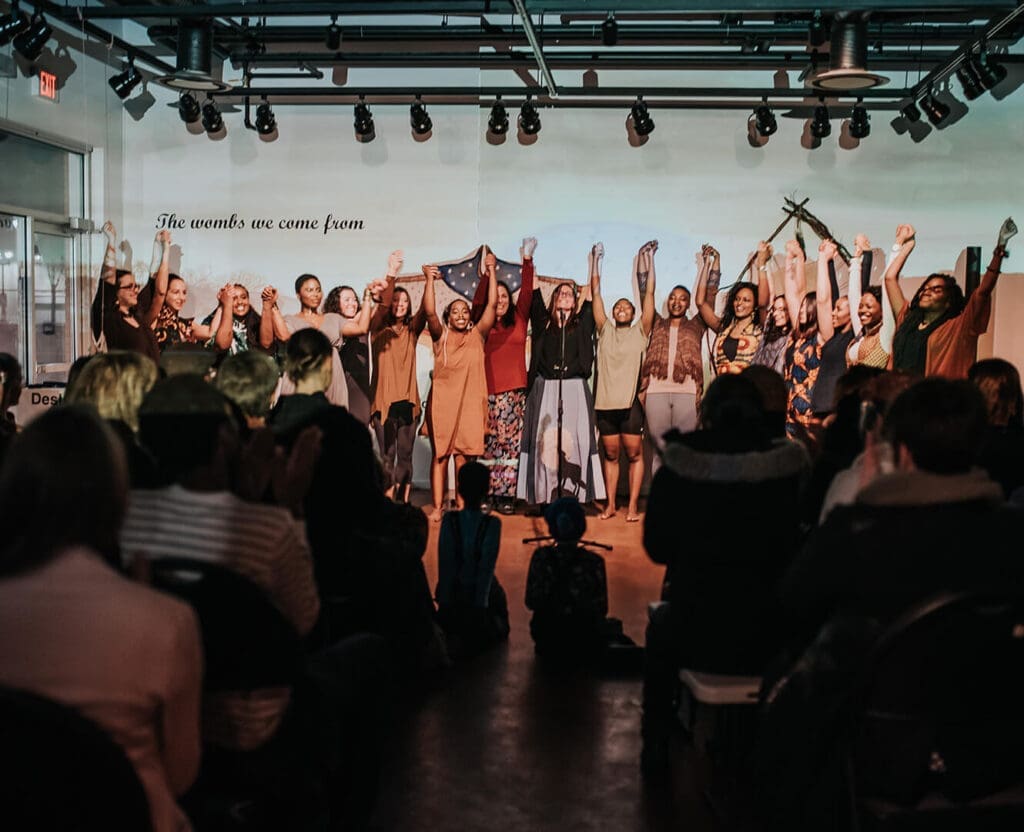 performers stand for a bow after a performance