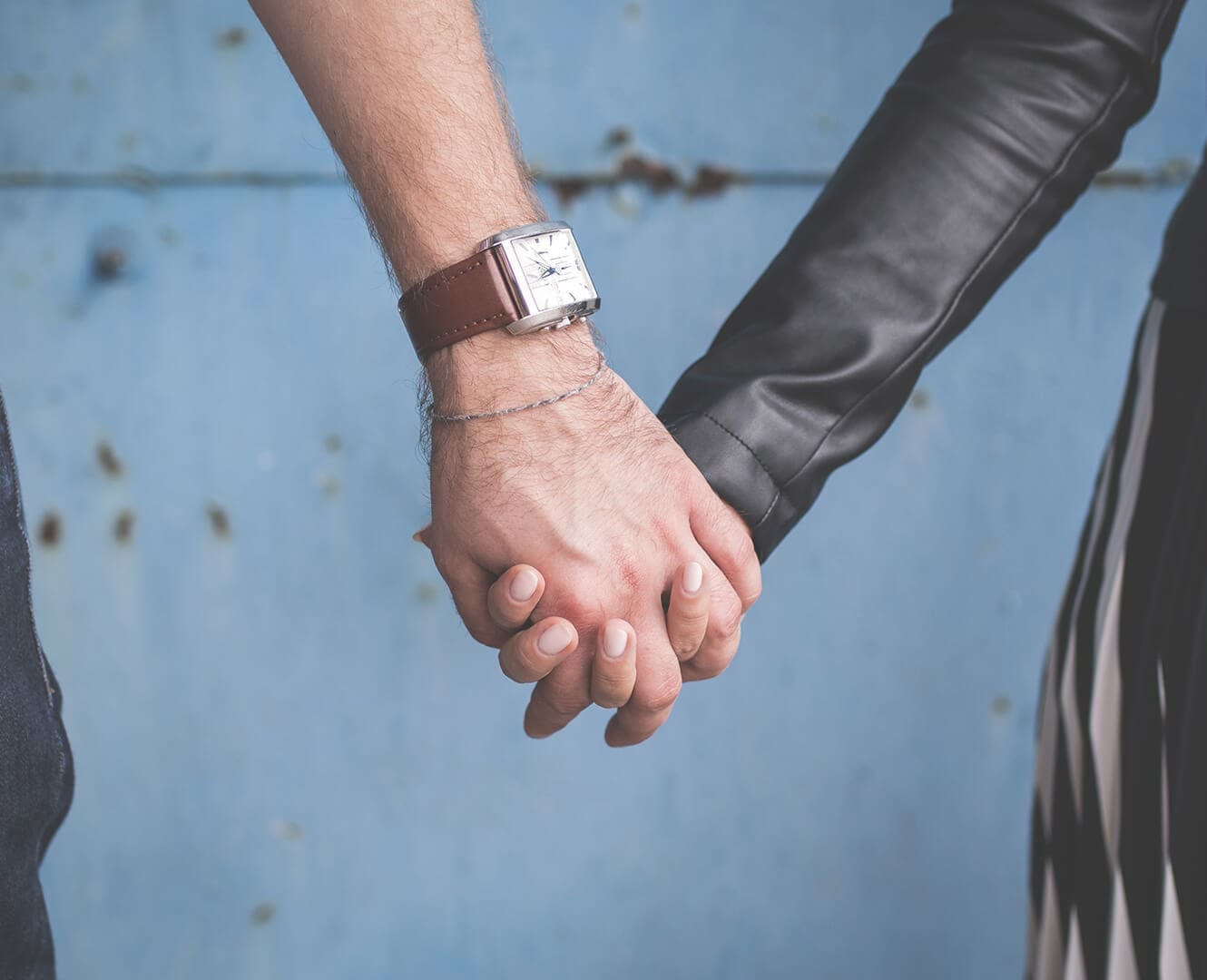 man and woman holding hands