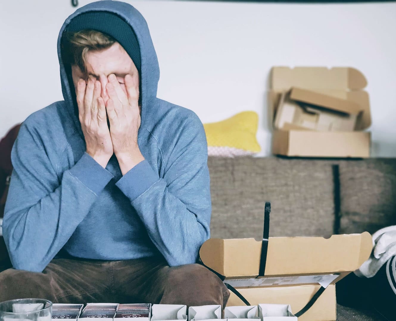 Man with head in hands stressed