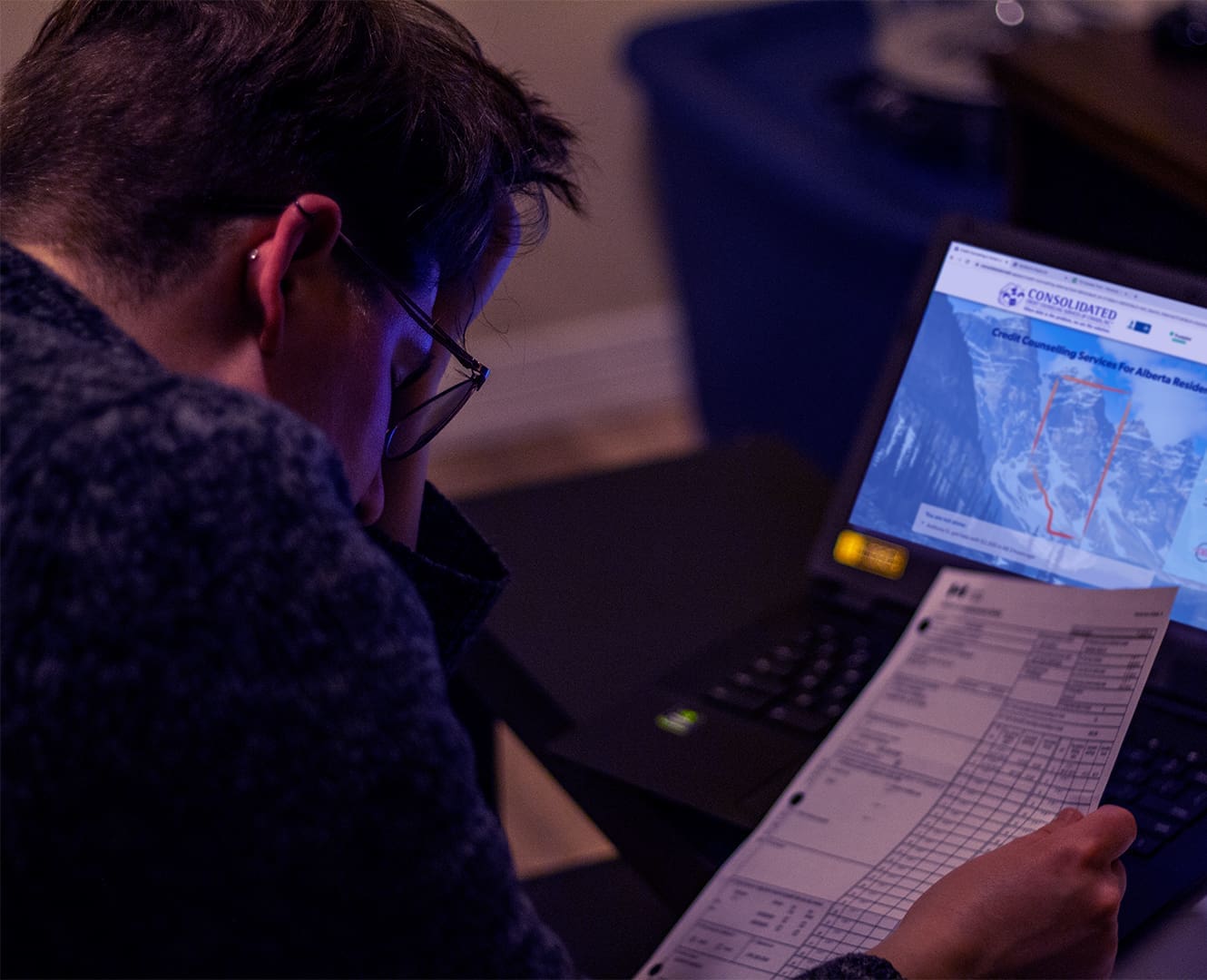 Person going over finances looking frustrated