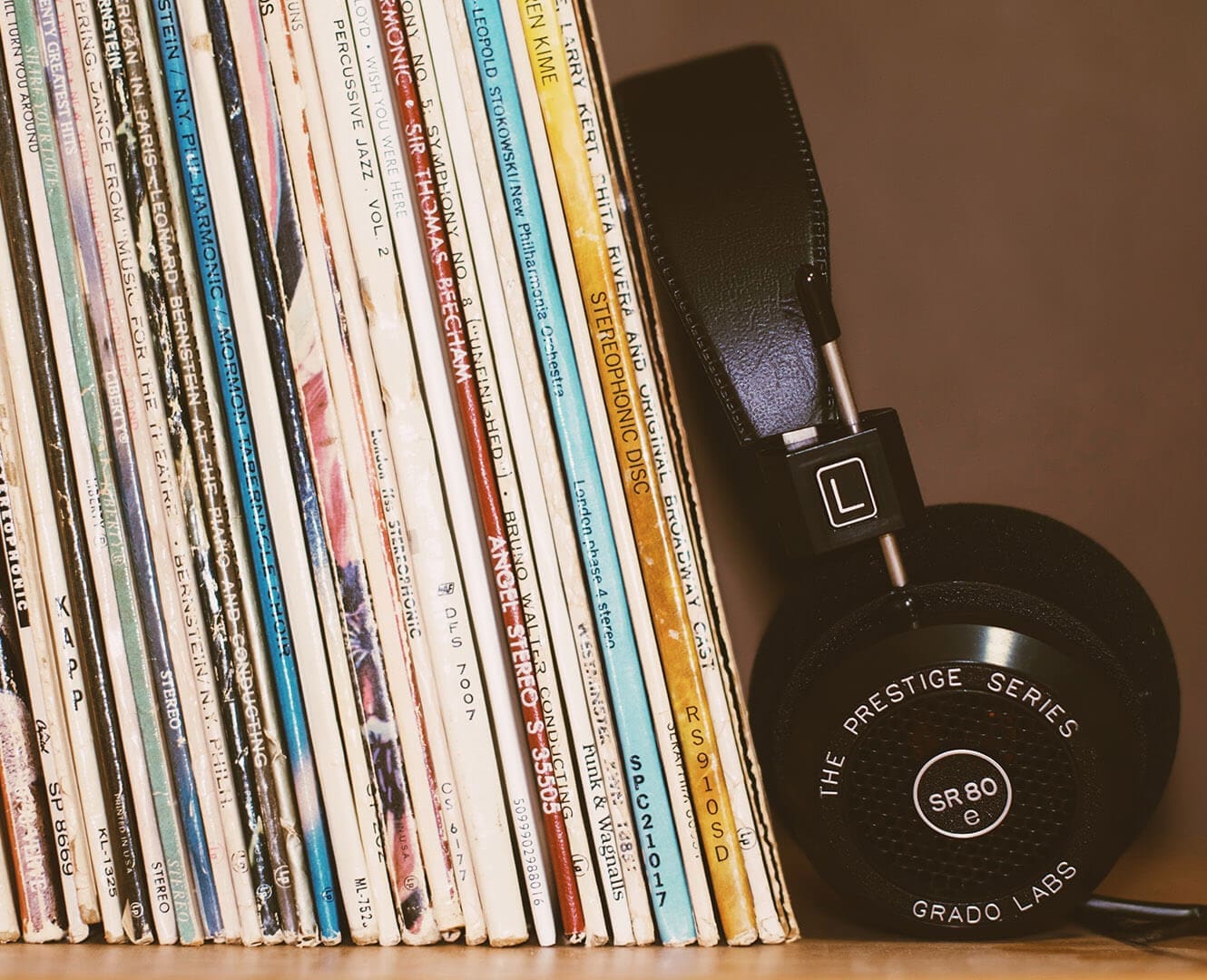 The Shuffle: Songs That Memes Ruines vinyl records on a shelf with a pair of black headphones