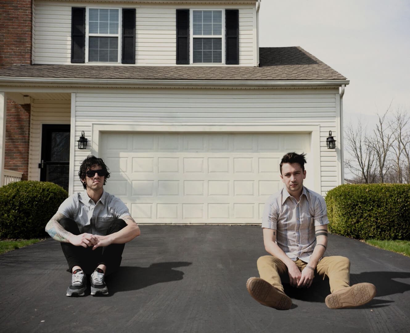 Songs released during the COVID-19 Quarantine Twenty One Pilots band sits in their front driveway