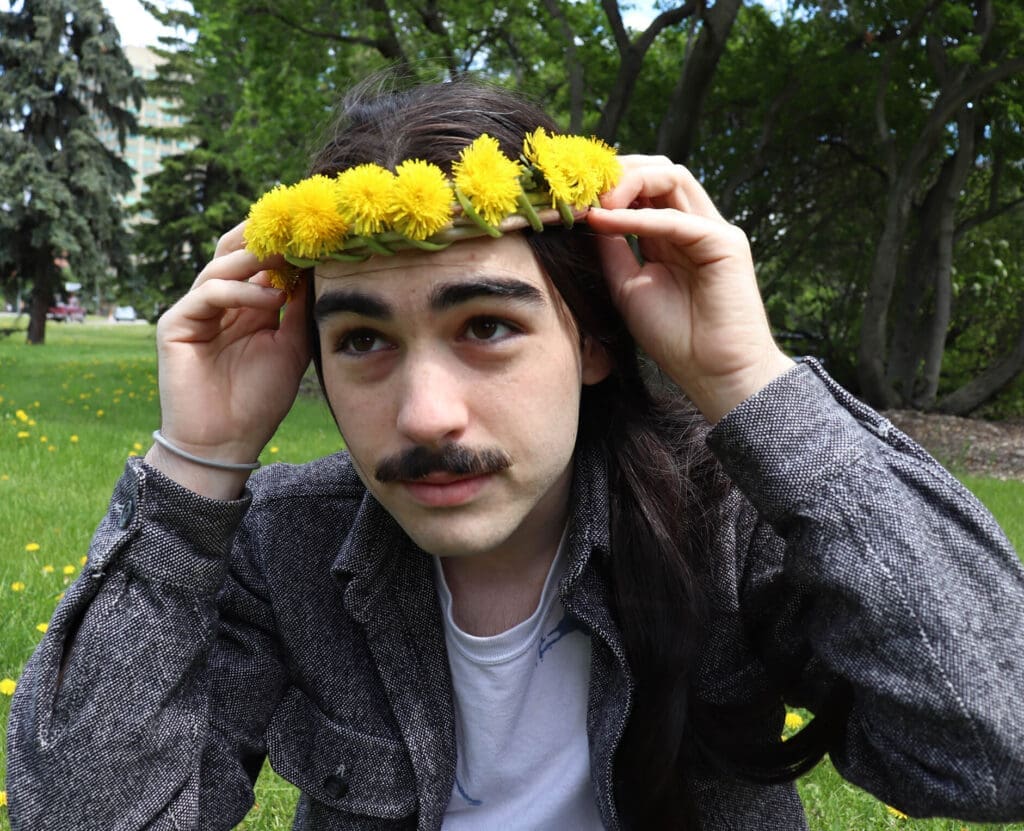 man wearing handmade flower crown