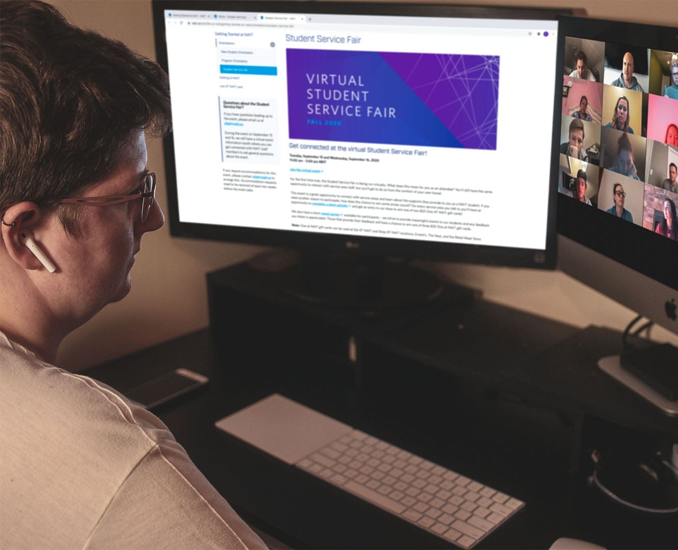 Woman sits at desk in front of computer