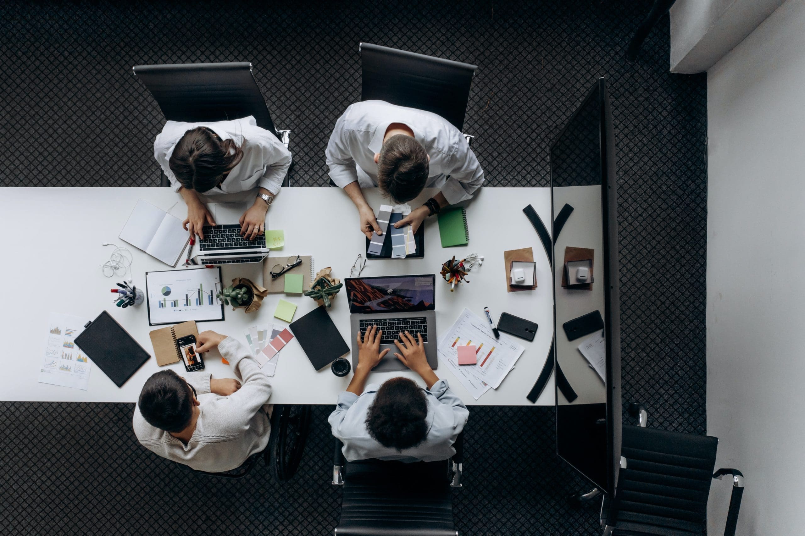 Above shot of a group of career people working together at a table.