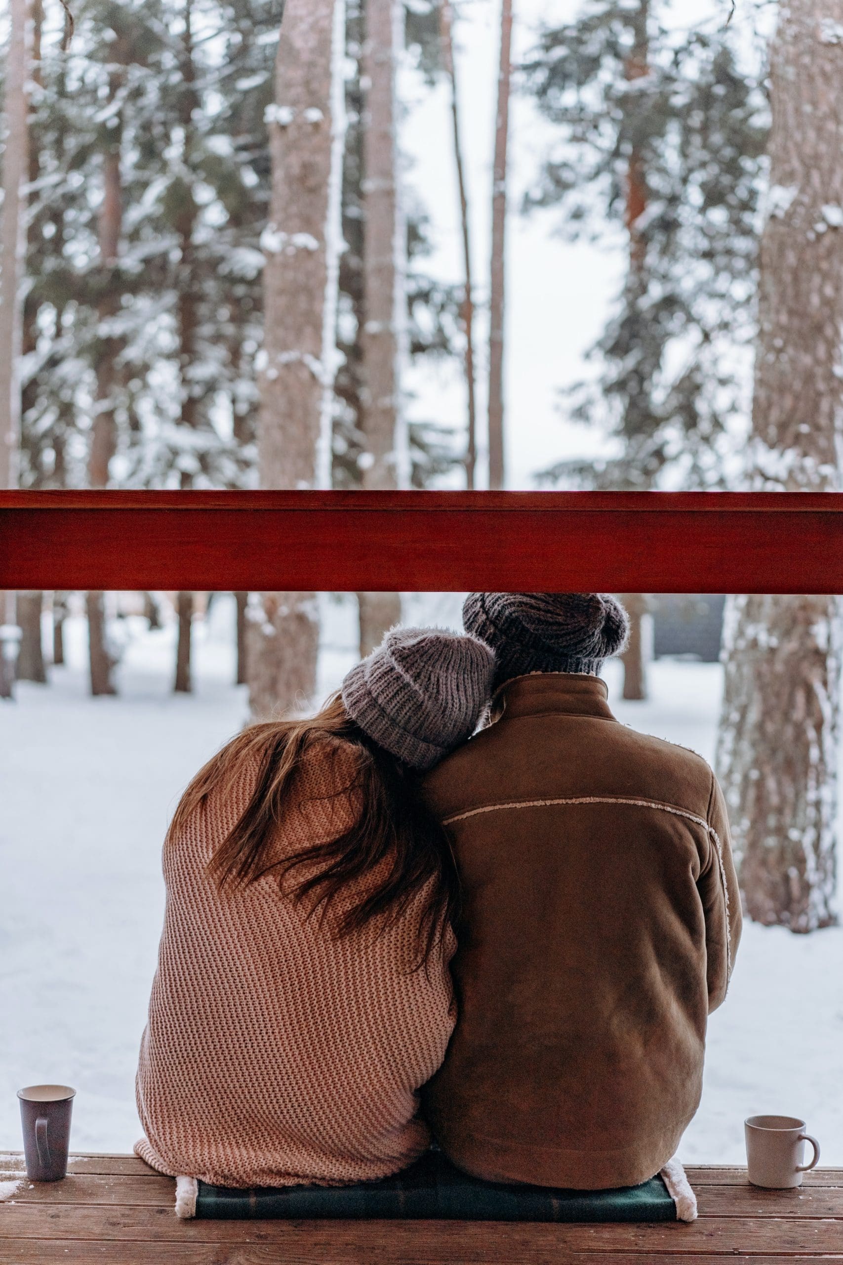 a couple in the winter sitting