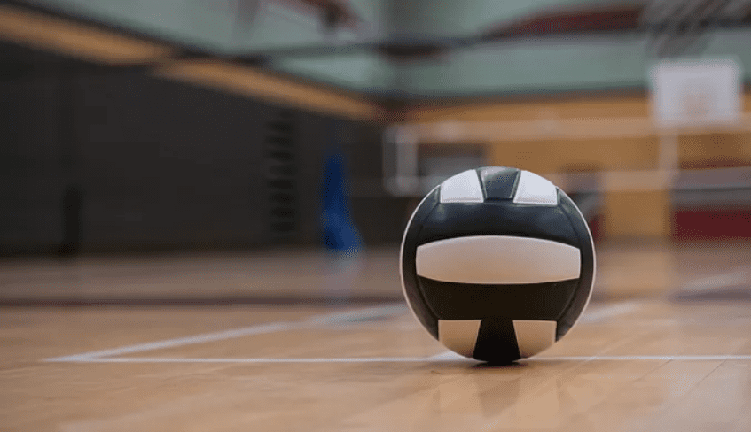 a handball sitting on a gym floor