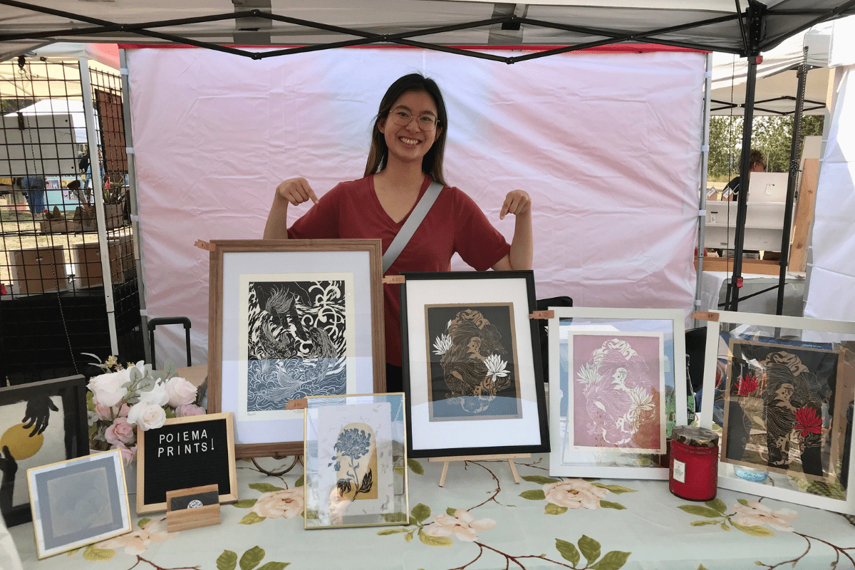 yoyo cover Yoyo Siu poses in front of her art at Strathearn Art Walk.