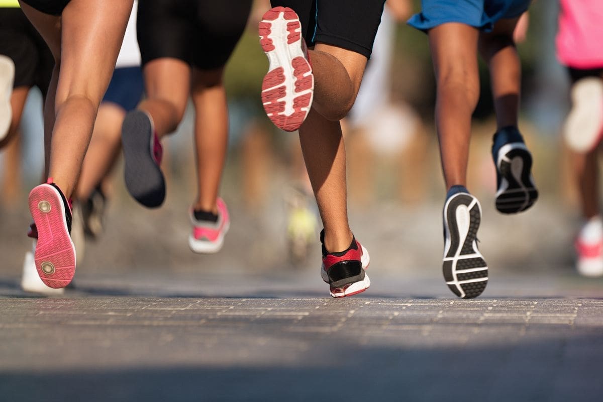 Stardom or doom Reflecting on what it takes to become a professional athlete image of several legs of different people running