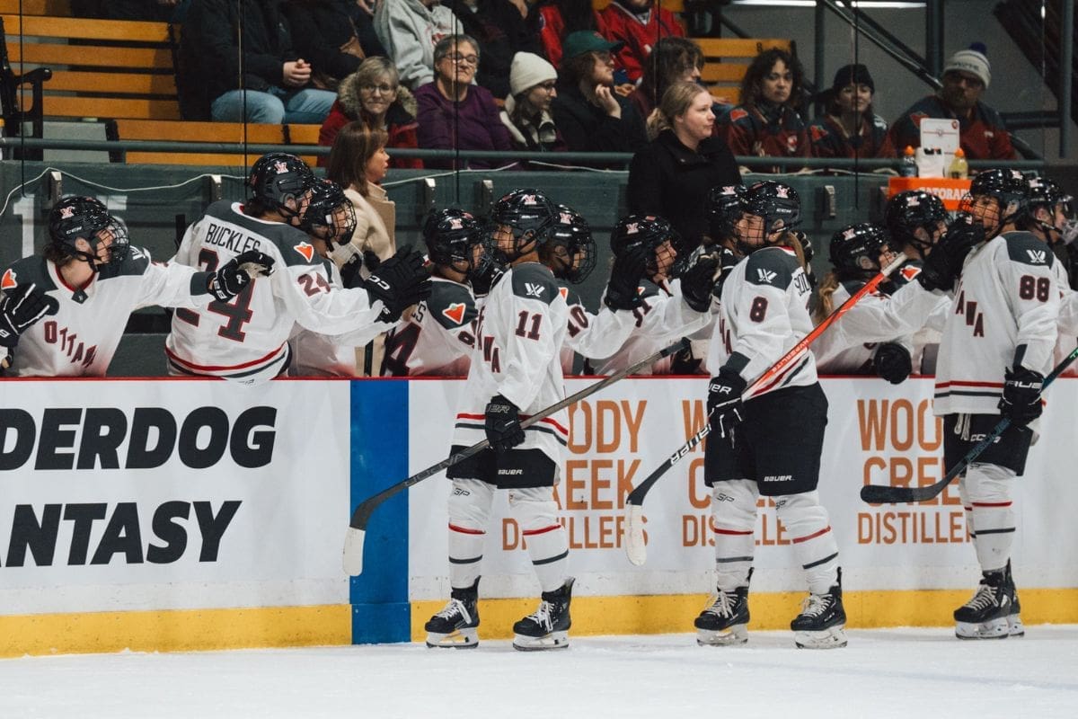 Akane Shiga celebrates with other PWHL players after scoring her first goal.
