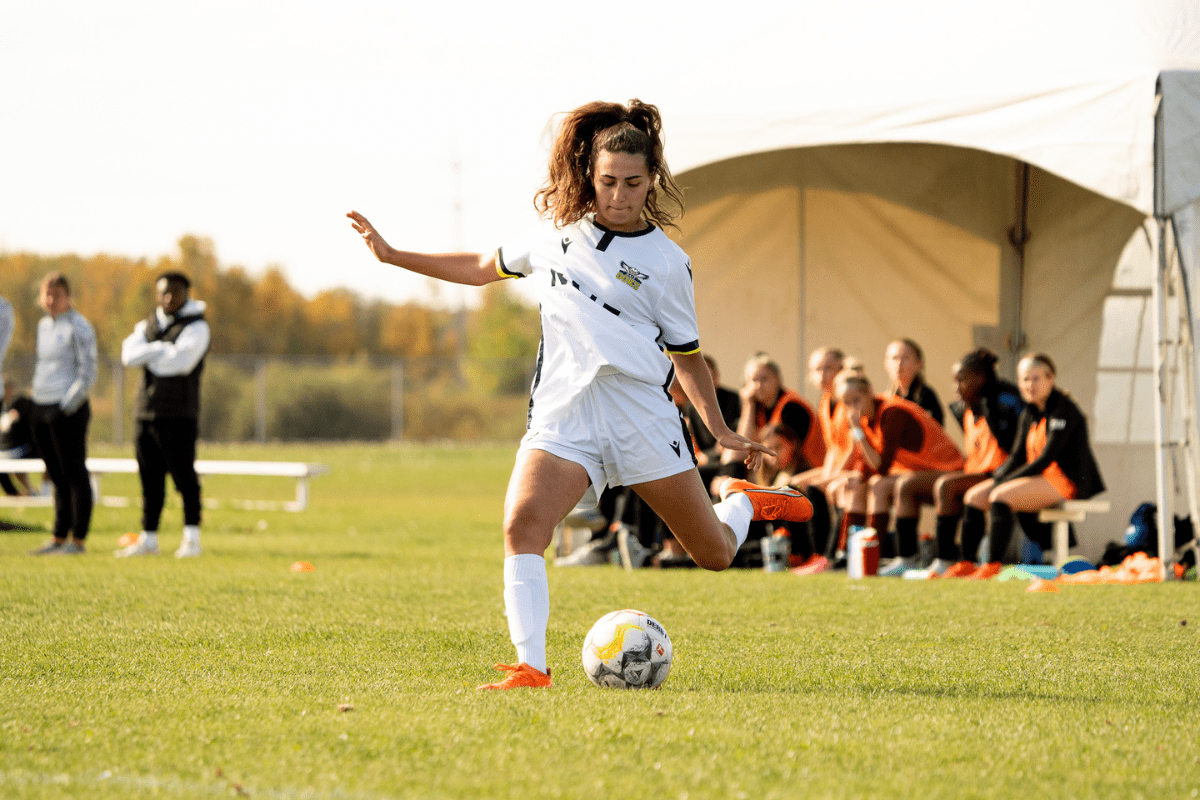 Ooks women's soccer player kicks soccer ball