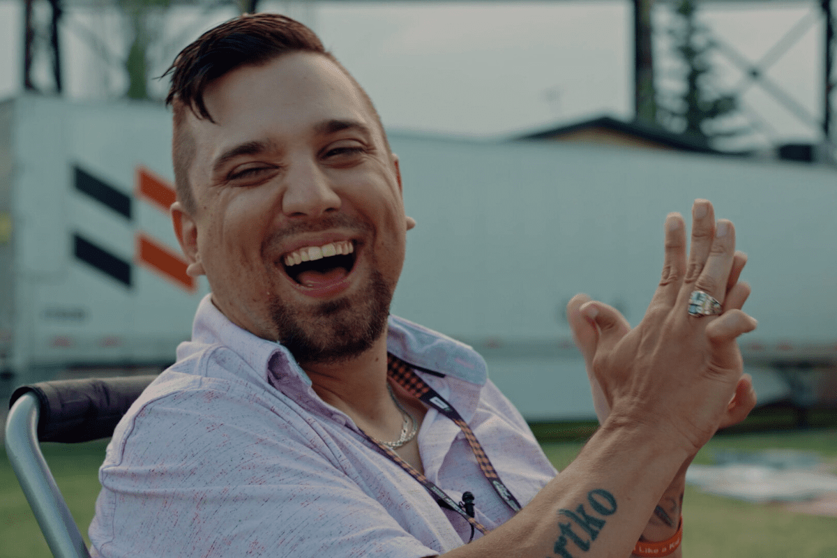 Brad Bartko is pictured laughing, a still taken from the short film Path Unpaved.