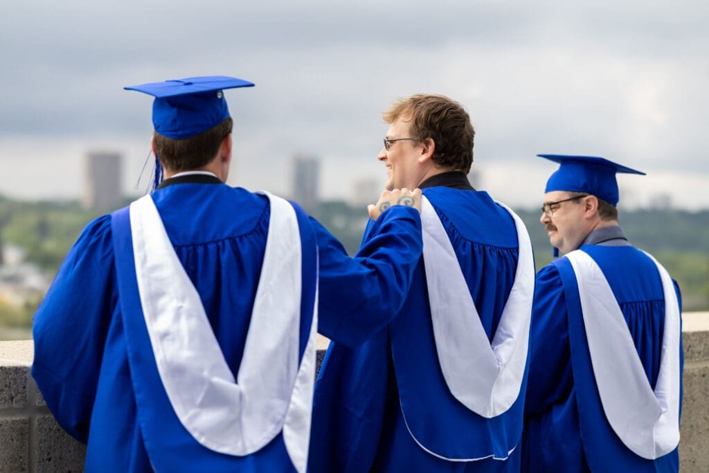 NAIT students look at Edmonton's skyline at Convocation 2025.