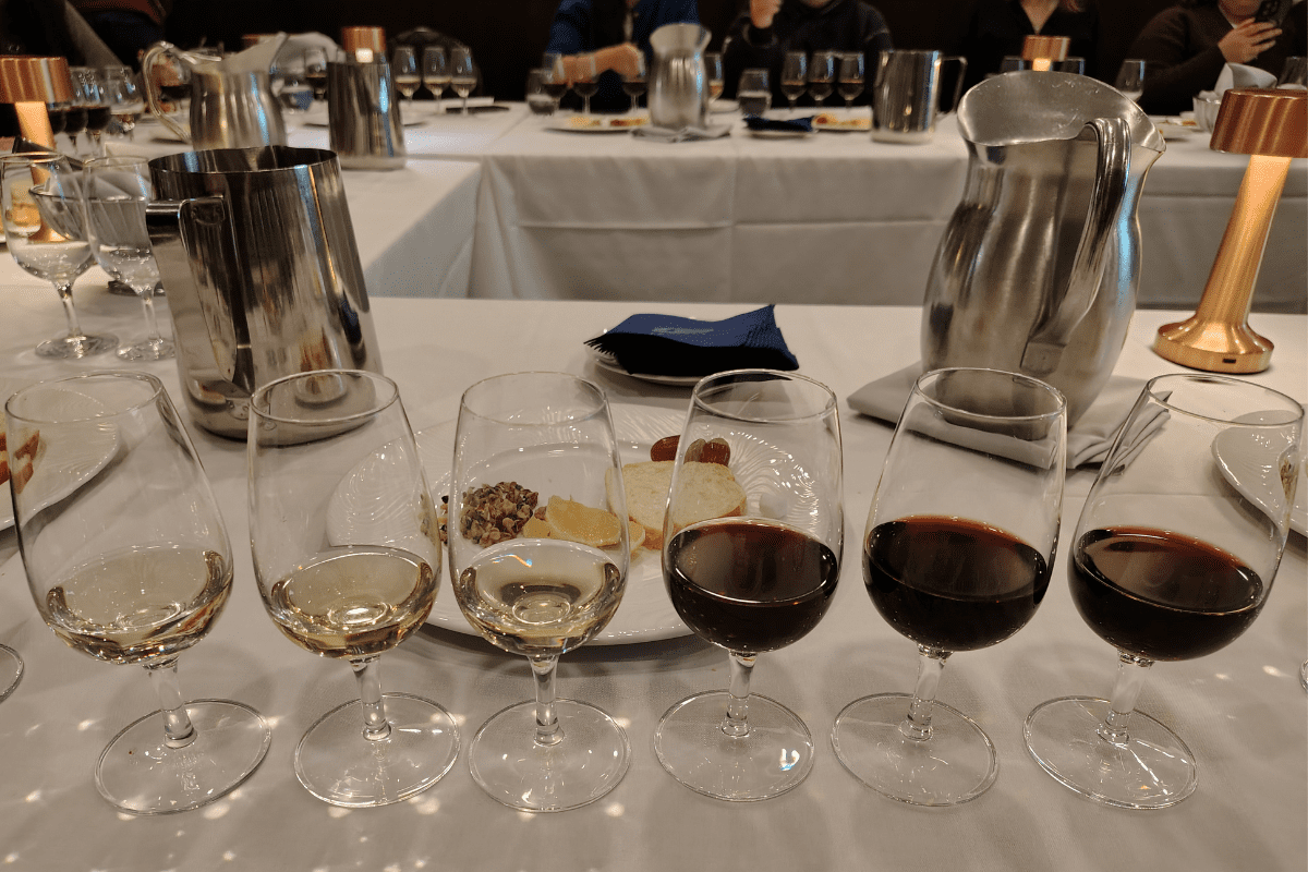 Six wines in a row, three are white and three are red.