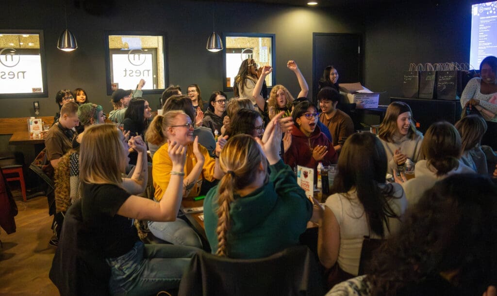 a group of young people cheer